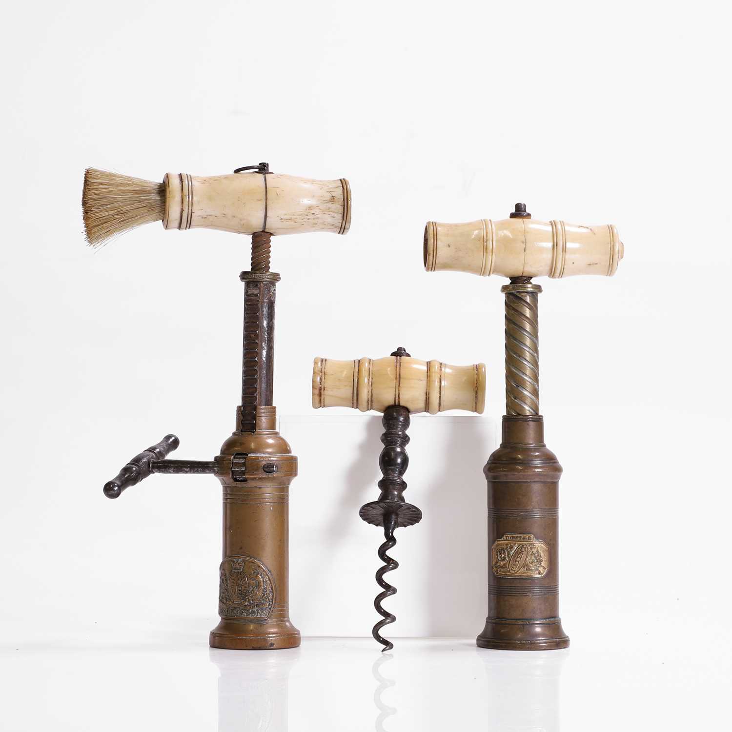 Lot 110 - A collection of three corkscrews