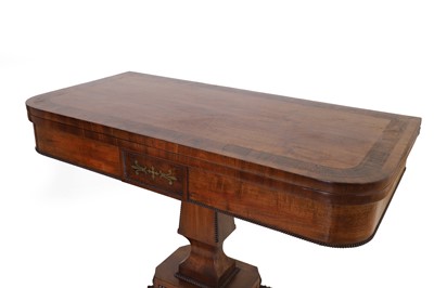 Lot 124 - A Regency strung mahogany fold-over card table