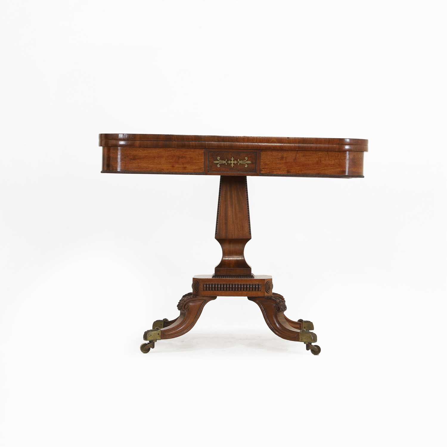 Lot 124 - A Regency strung mahogany fold-over card table