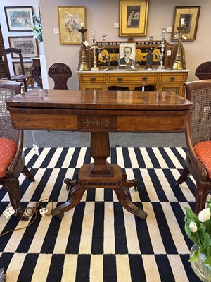 Lot 124 - A Regency strung mahogany fold-over card table