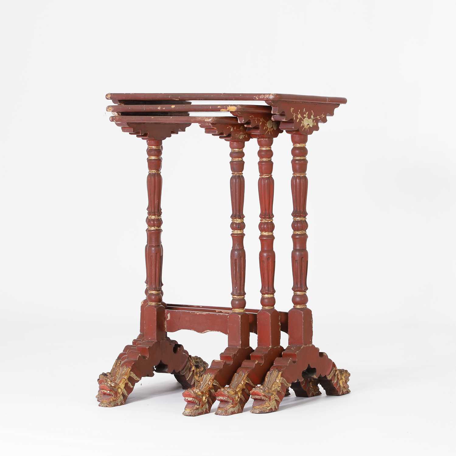 Lot 80 - A nest of three red-lacquered tables