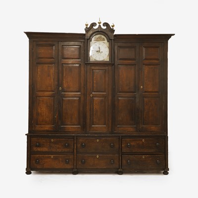 Lot 154 - A grained oak clock cupboard