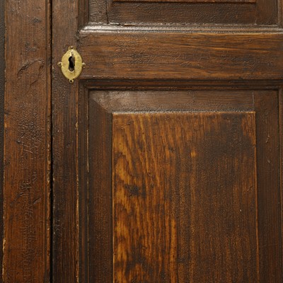 Lot 154 - A grained oak clock cupboard