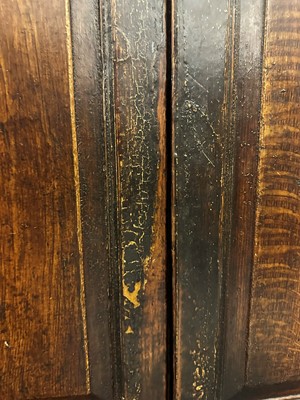 Lot 154 - A grained oak clock cupboard