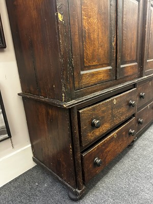 Lot 154 - A grained oak clock cupboard