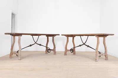 Lot 252 - A pair of oak and iron console tables