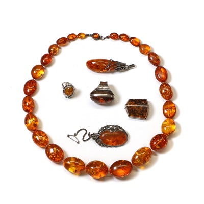 Lot 1359 - A group of clarified amber jewellery