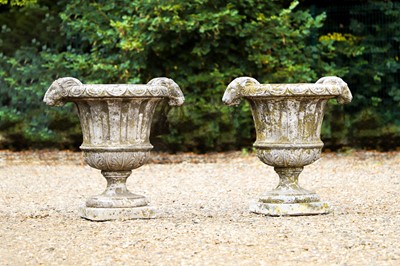 Lot 270 - A pair of composition stone garden urns