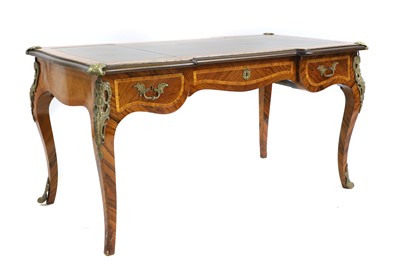 Lot 766 - A Louis XV-style walnut and inlaid bureau plat