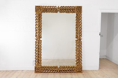 Lot 194 - A large Regency-style carved giltwood mirror