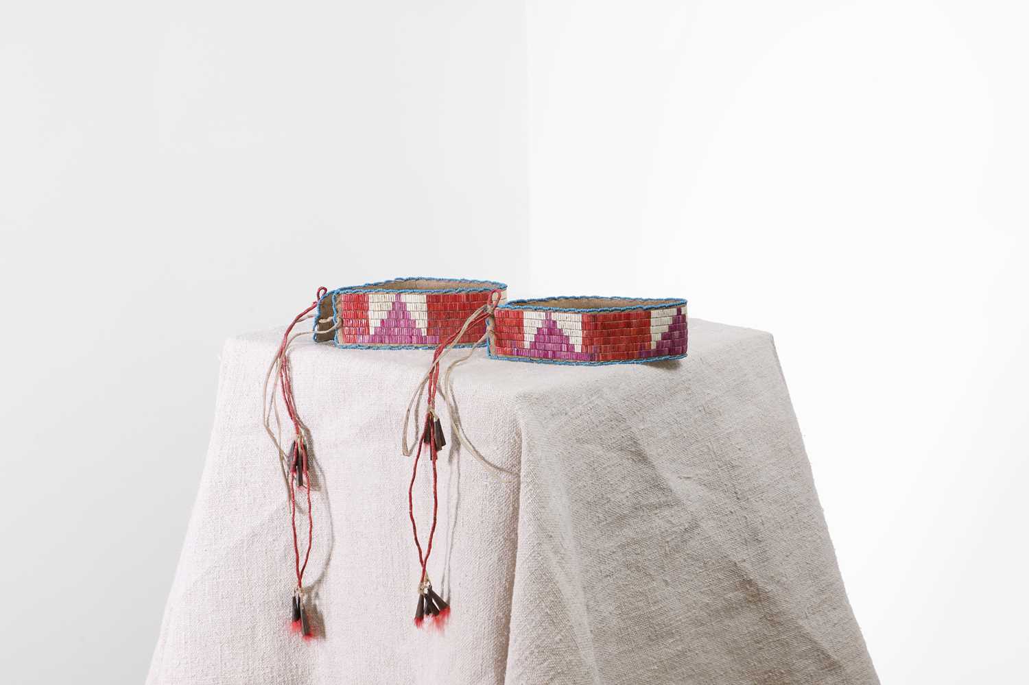 Lot 310 - A pair of Native American quilled hide arm bands