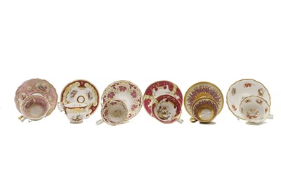 Lot 188 - A group of twelve porcelain teacups and covers