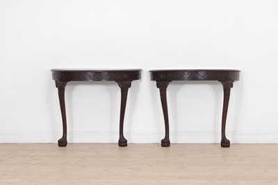 Lot 586 - A pair of Irish George II-style mahogany demilune pier tables