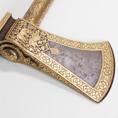 Lot 222 - A Mughal Deccan koftgari 'tabarzin' saddle axe