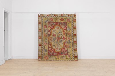 Lot 560 - A large needlepoint carpet