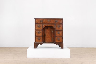 Lot 76 - A George II walnut kneehole desk