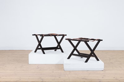 Lot 467 - A pair of ebonised wooden luggage racks