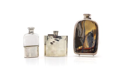 Lot 30 - A group of three silver hip flasks