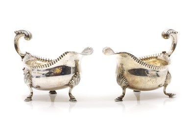 Lot 23 - A pair of George III silver sauceboats