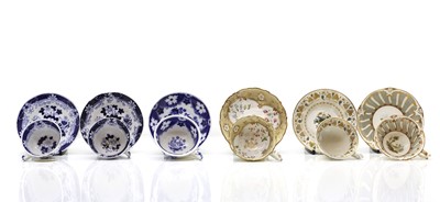 Lot 211 - A collection of twelve porcelain teacups and saucers