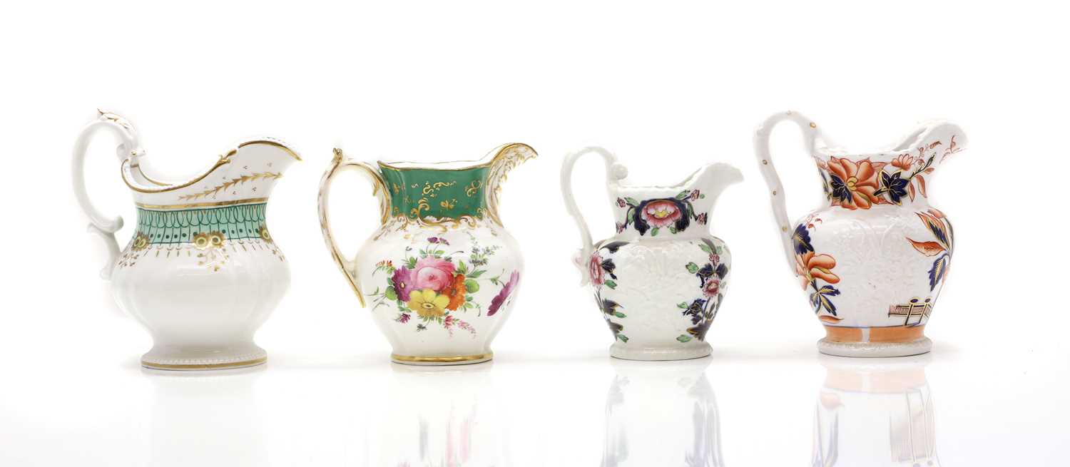 Lot 202 - A collection of eight cream jugs,