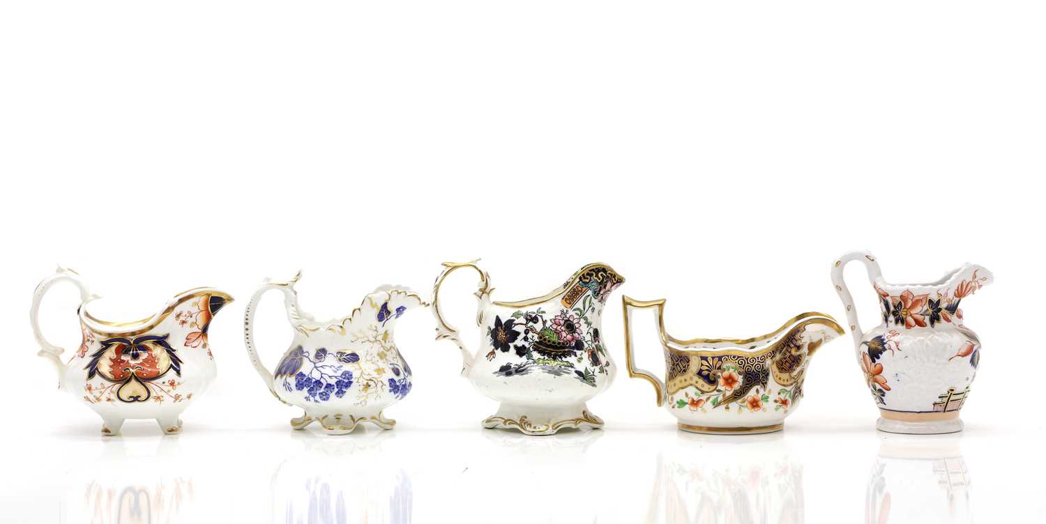 Lot 213 - A collection of ten cream jugs,