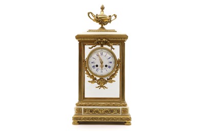 Lot 244 - An ormolu and white marble four glass mantel clock