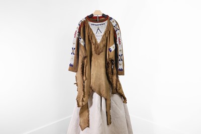 Lot A Native American man's beaded hide war shirt