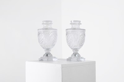 Lot 23 - A pair of cut-glass covered urns