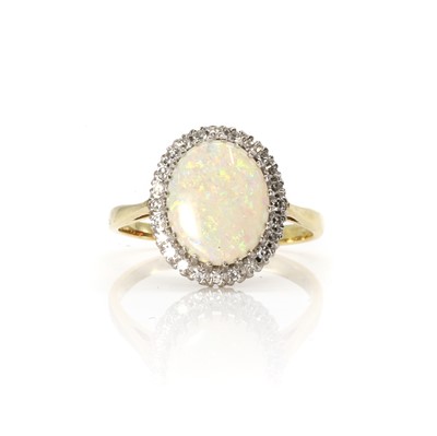 Lot 168 - An 18ct gold opal and diamond cluster ring