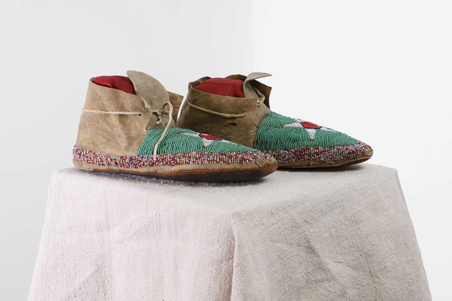 Lot 297 - A pair of Native American beaded hide moccasins