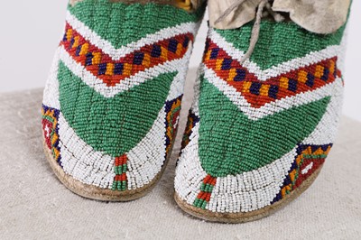 Lot 337 - A pair of Native American beaded hide moccasins