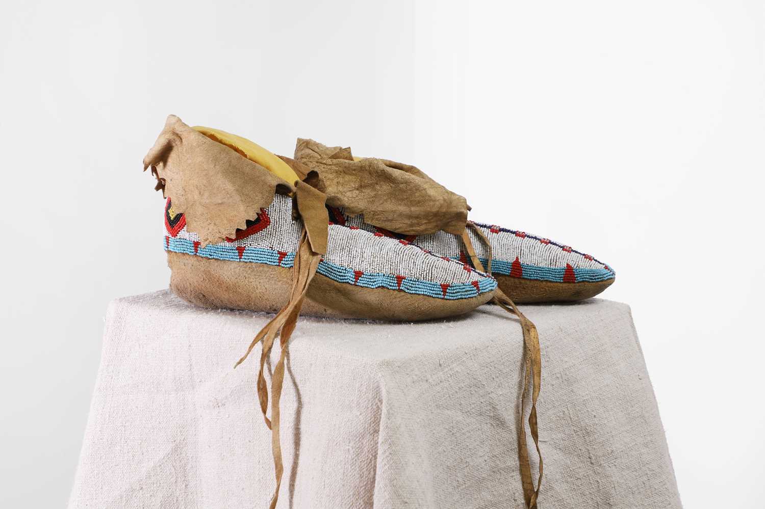 Lot 351 - A pair of Native American beaded hide moccasins