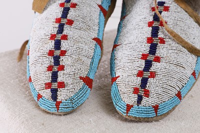 Lot 351 - A pair of Native American beaded hide moccasins