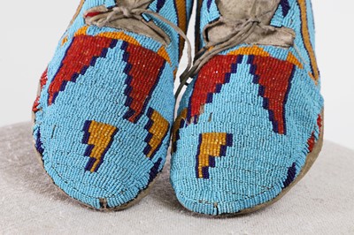 Lot 334 - A pair of Native American beaded hide moccasins