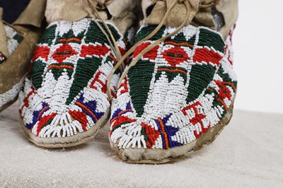 Lot 302 - Two pairs of Native American beaded hide moccasins