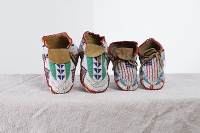 Lot 348 - Two pairs of Native American beaded hide moccasins