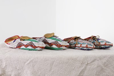 Lot 348 - Two pairs of Native American beaded hide moccasins