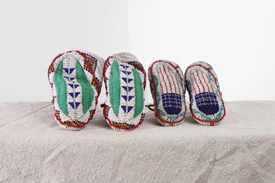 Lot 348 - Two pairs of Native American beaded hide moccasins