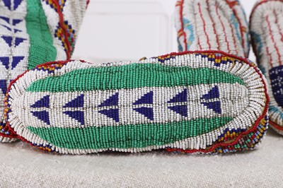 Lot 348 - Two pairs of Native American beaded hide moccasins