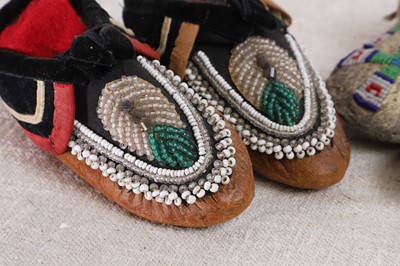 Lot 342 - A collection of Native American children's beaded hide moccasins