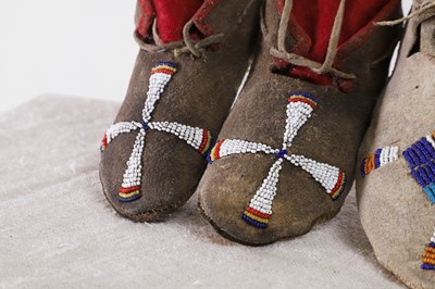 Lot 342 - A collection of Native American children's beaded hide moccasins