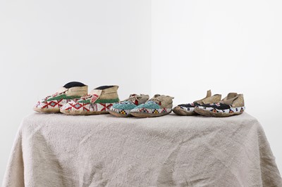 Lot 342 - A collection of Native American children's beaded hide moccasins