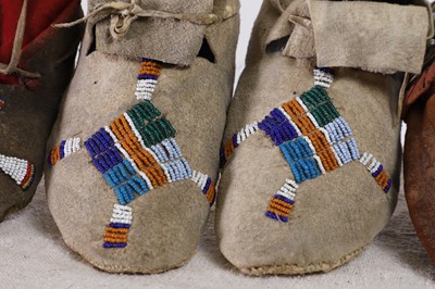 Lot 342 - A collection of Native American children's beaded hide moccasins