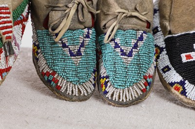 Lot 342 - A collection of Native American children's beaded hide moccasins