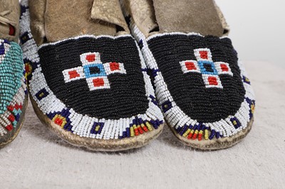 Lot 342 - A collection of Native American children's beaded hide moccasins