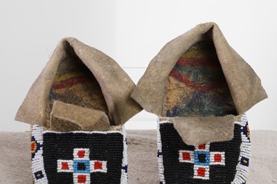 Lot 342 - A collection of Native American children's beaded hide moccasins