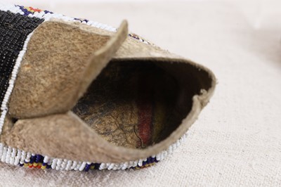 Lot 342 - A collection of Native American children's beaded hide moccasins