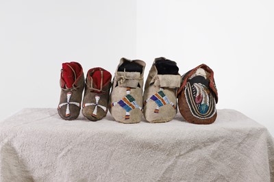 Lot 342 - A collection of Native American children's beaded hide moccasins