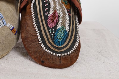 Lot 342 - A collection of Native American children's beaded hide moccasins